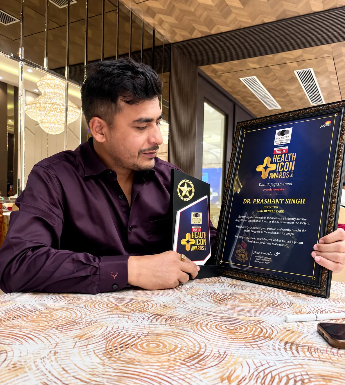Dr. Prashant Singh with the Health Icon Award 2025 trophy and citation